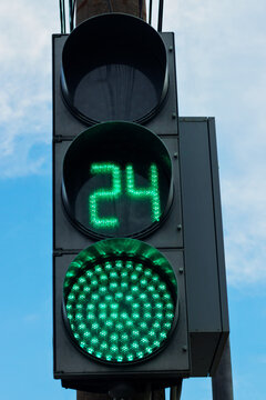 Modern LED traffic light with green resolution.