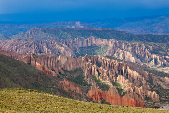 The multi-colored layers of eroded badlands catch the last rays at sunset near Tupiza (Potosi Dept.) , in Bolivia's' Sud Lipez region of the southeastern Altiplano.