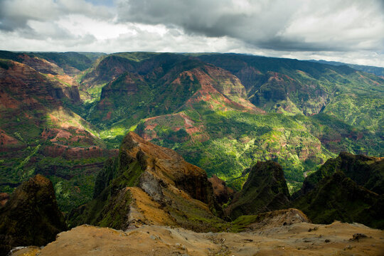 Views of Waimea Canyon from the rim show steep canyons, lush vegetation and erosion.