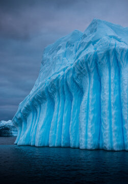 Intricate patterns cut by nature in an iceberg in Antarctica.