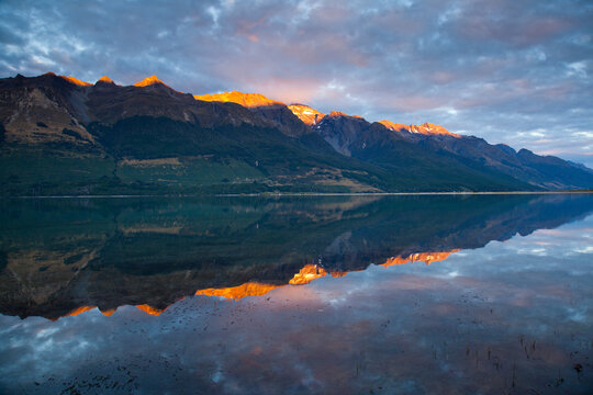 Early AM sun hits the high peaks of the Southern Alps above Lake Wakatipu near Glen Orchy in New Zealand's South Island.