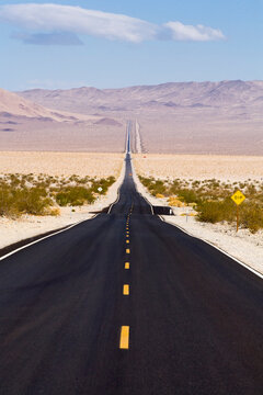A long stretch of Highway 127 stretches across the desert in southern California