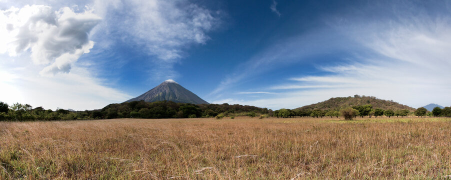 Volcano Concepci n in an idyllic grass field landscape on Ometep Island in Nicaragua.