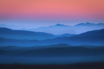 The glowing mist in the predawn hour over the distant Cascade range in Oregon.
