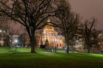The Massachusetts State House as viewed at night from the Boston Commons in Boston, MA.
