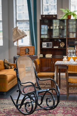 big black old rocking chair in focus Polish 70s style