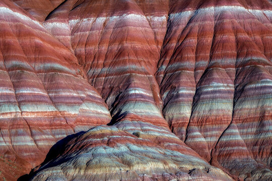 The colorful striations of this unique sandstone glow in sunset light along the Paria River, Utah.