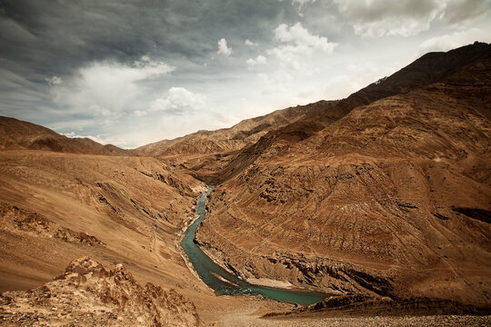 The Indus river flows through the high desert of Ladakh, India