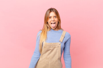 young woman with cheerful and rebellious attitude, joking and sticking tongue out