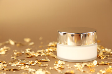 Cosmetic glass jar with white moisturizer. Luxurious antiaging day cream with isoflavones and...