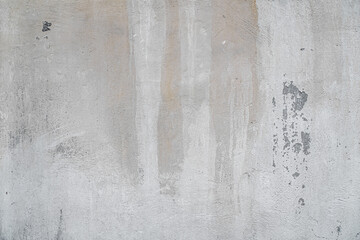 abstract background of an old shabby painted white concrete wall close up