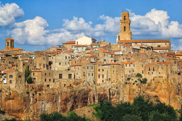 Late afternoon light illuminates the medieval walled city of Pitigliano in Southern Tuscany, Italy.