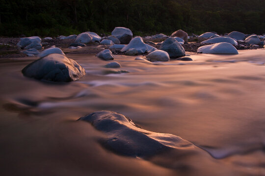 Sunset casts a golden glow over the Cangrejal River, Honduras.