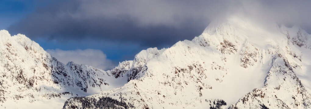 A winter storm begins to break up over the Middle Sister Peak in the Northern Cascades of Washington.