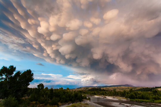Lightning strikes from mammatus clouds above the Sleeping Indian in Grand Teton National Park, Wyoming.