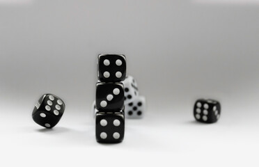 Black and white dice in various positions.
