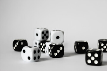 Black and white dice in various positions.