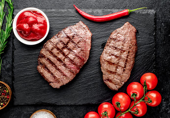 grilled beef steak on stone background