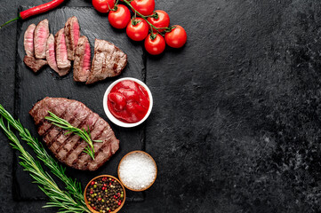 grilled beef steak on stone background with copy space for your text