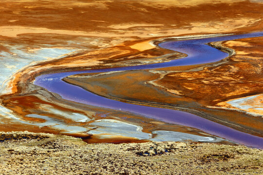 Stream polluted by chemicals and waste from nearby mine entering Lake Milluni, near La Paz, Bolivia.