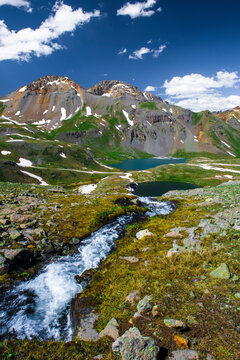 Ice lake Basin, CO: Pilot Knob and Ulysses S. Grant peak as viewed from the top of a small waterfall coming from Fuller Lake