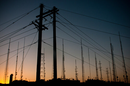 Power lines and antennas line the hilltop outside Phoenix, AZ.