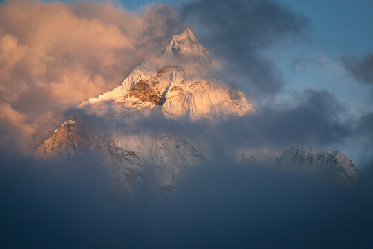 A portrait of the triangular peak of Ama Dablam at sunset in Nepal's Khumbu Region.