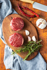 The raw beef meat steak on cutting board.