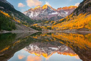 First light on the Maroon Bells in fall outside of Aspen, Colorado.