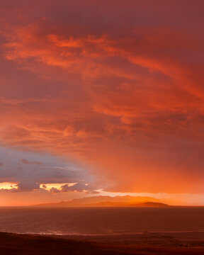 Spring storm rolls across the Great Salt Lake, at sunset.
