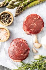The raw beef meat steak on white papper.