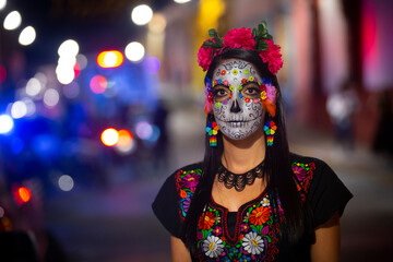 Woman's face with ceremonial make-up also known as Sugar skull, used in traditional Mexican Dia de...