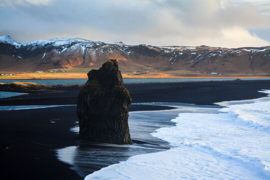 Coastal landscape with volcanic black sand at Dyrholaey. Vik. Iceland.