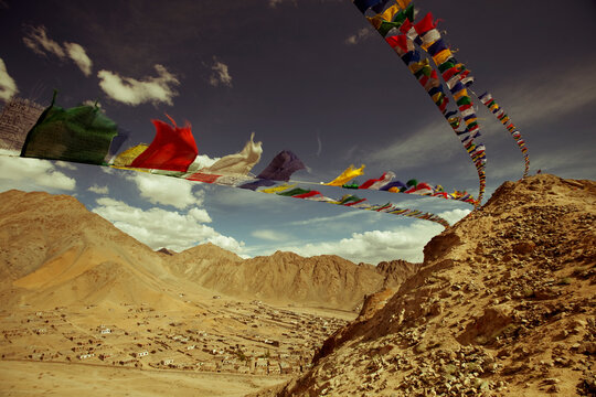 Tibetan prayer flags hanging on the mountains surrounding Leh in Ladakh, Jammu & Kashmir, India