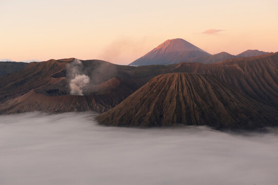 Mount Bromo (large crater, left) at sunrise in Bromo-Tengger-Semeru National Park on the island of Java in Indonesia