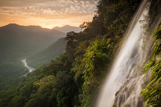 A view of the Cangrejal River and the Nombre de Dios mountain range taken by rappelling down the Bejuco Waterfall in Pico Bonito National Park, Honduras.