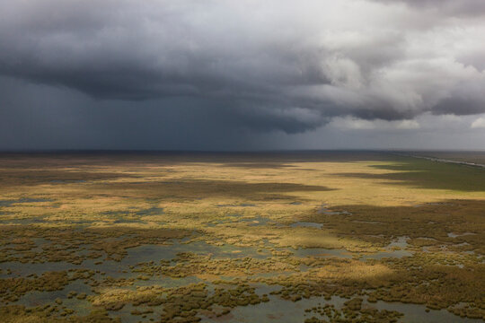 Summer rainstorms release over the sawgrass prairies photographed from a helicopter in the Everglades Water Conservation Areas, Florida.