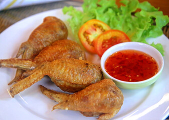 Fried chicken wings in a thai restaurant