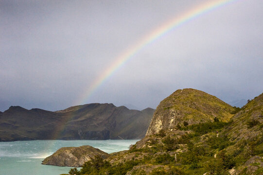 Waterspouts and rainbows during a day of stormy weather with 100 mph wind gusts in Torres del Paine, Patagonia, Chile.