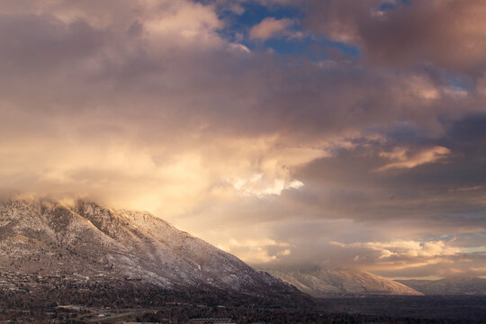 Winter Landscape image of Salt Lake Valley with mountains and clouds.