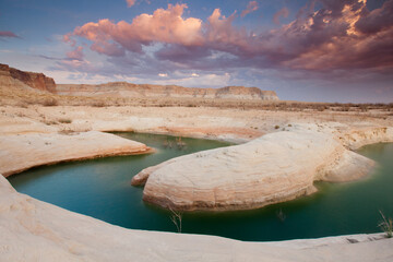 Scenic landscape image of Lake Powell, UT at sunset.