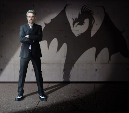 Strength Businessman Super Hero  - Man In A Suit - His True Self Is A Strenght Dangerous Dragon. 