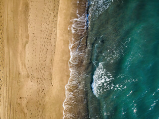 Fototapeta na wymiar Aerial view of Patara beach, top down view of clear turquoise sea and waves on beach