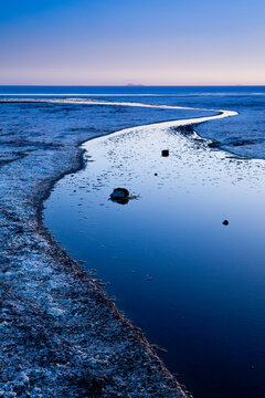 Sunset on the edge of the Salar de Uyuni on Bolivia's Altiplano.