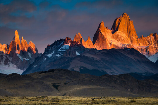 First light hits Cerro Torre and Mount Fitz Roy in Los Glacieres National Park, Argentina.