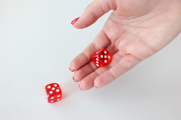 In hand are red cubes with numbers