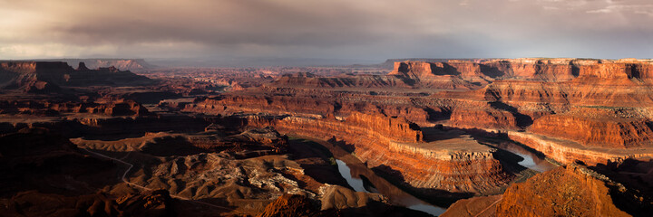 Stormy sunrise high resolution panoramic of Dead Horse Point State Park in Utah.