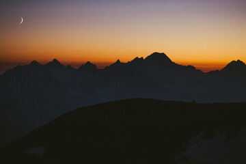 Moonrise over the cascades seen from base camp on Mt Baker, Washington.