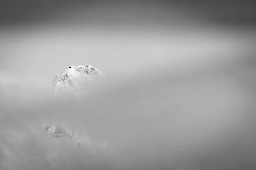 Mount Shuksan breaks out of a winter storm system for mere minutes in the Cascades.