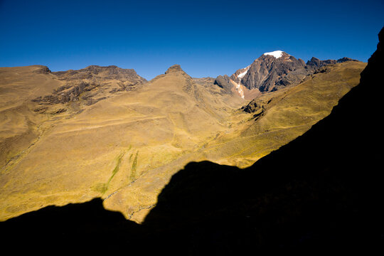 The glacier-covered summit of Mt. Akhamani rises above the puna and valleys in the Apolobamba Range in Bolivia.